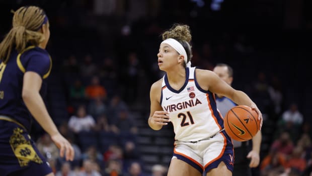 Kymora Johnson handles the ball during the Virginia women's basketball game against Notre Dame at John Paul Jones Arena.